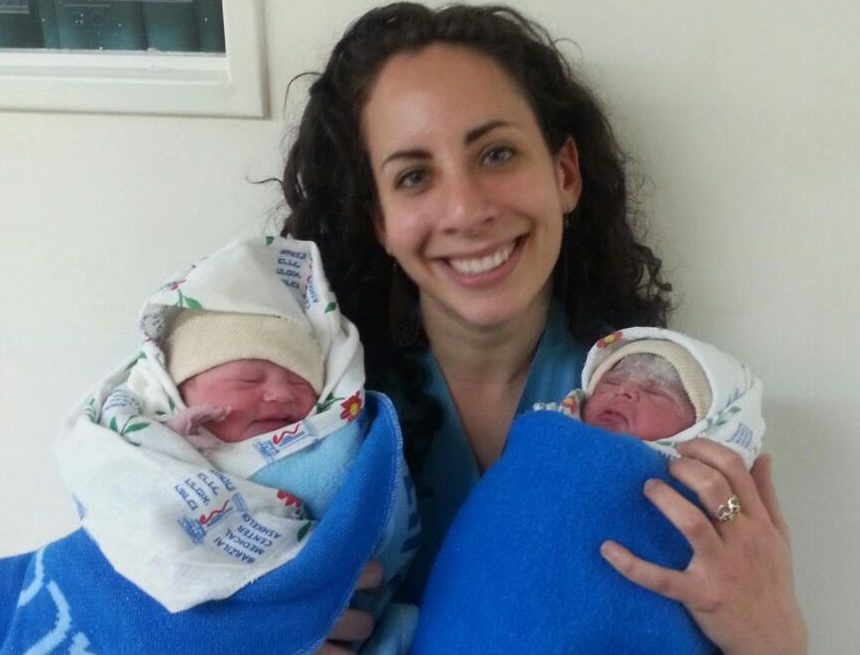 Dr. Jennifer Eitingon holding two babies